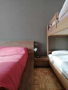 Postel nebo postele na pokoji v ubytování ALPINO B&B