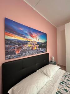 Postel nebo postele na pokoji v ubytování Riflessi su Ibla