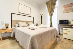 Ένα ή περισσότερα κρεβάτια σε δωμάτιο στο Casa Príncipe Pío