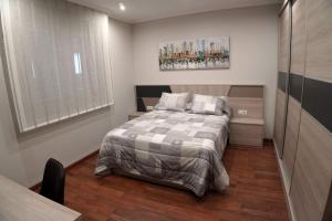 Ένα ή περισσότερα κρεβάτια σε δωμάτιο στο Hospedaje Casa Ribeira Sacra