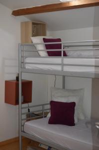a couple of bunk beds in a room at A L ESCALE PASSA PAÏS in Le Poujol-sur-Orb