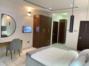 TV a/nebo společenská místnost v ubytování Luxxe Lekki + 3 fotografie