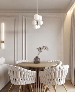 a dining room with a table and chairs at Louise Delux- Free privat parking in Nyíregyháza