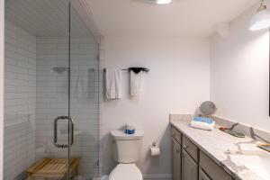 a bathroom with a shower and a toilet and a sink at Mountain Bliss at Hound Ears in Valle Crucis +66 photos