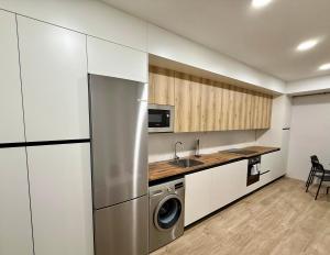 Kuchyň nebo kuchyňský kout v ubytování Espacios Blanco Santiago