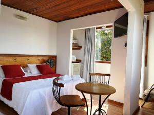 Postel nebo postele na pokoji v ubytování Pousada Vista de Lavras