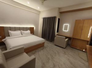 Postel nebo postele na pokoji v ubytování Vilaasitaa Family Suites