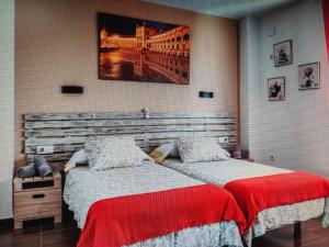 Postel nebo postele na pokoji v ubytování loft Alameda de Hercules