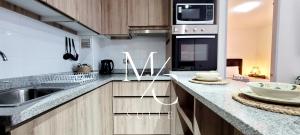Η κουζίνα ή μικρή κουζίνα στο Exclusivo departamento Icono