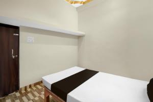 Ένα ή περισσότερα κρεβάτια σε δωμάτιο στο Hotel O Hamar Mitan