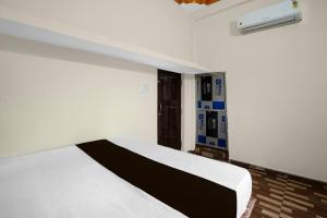 Ένα ή περισσότερα κρεβάτια σε δωμάτιο στο Hotel O Hamar Mitan +21 φωτογραφίες