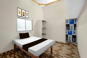 Ένα ή περισσότερα κρεβάτια σε δωμάτιο στο Hotel O Hamar Mitan