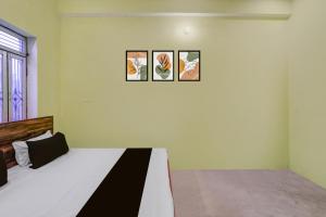 Ένα ή περισσότερα κρεβάτια σε δωμάτιο στο SPOT ON Yatri Nivas Hotel