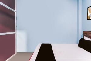 Ένα ή περισσότερα κρεβάτια σε δωμάτιο στο SPOT ON Yatri Nivas Hotel +20 φωτογραφίες