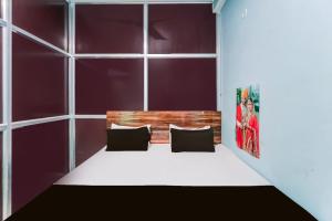 Ένα ή περισσότερα κρεβάτια σε δωμάτιο στο SPOT ON Yatri Nivas Hotel