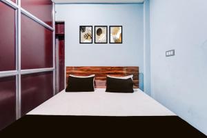 Ένα ή περισσότερα κρεβάτια σε δωμάτιο στο SPOT ON Yatri Nivas Hotel