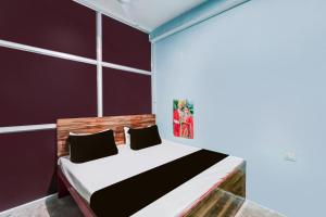 Ένα ή περισσότερα κρεβάτια σε δωμάτιο στο SPOT ON Yatri Nivas Hotel