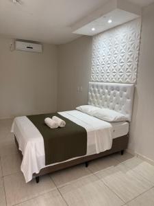 Ένα ή περισσότερα κρεβάτια σε δωμάτιο στο Hotel pousada XiqueXique