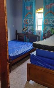 Postel nebo postele na pokoji v ubytování Casa Luar do Morro