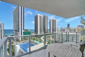 a balcony with a view of the ocean and buildings at HYDE 2BR & 2BA Oceanview - No Hotel Fees thru Dec 31 in Hollywood