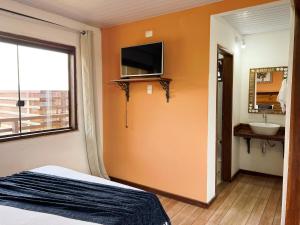 TV a/nebo společenská místnost v ubytování Pousada Vista de Lavras