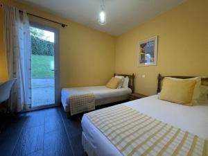 Ένα ή περισσότερα κρεβάτια σε δωμάτιο στο Iduzkia +11 φωτογραφίες