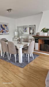 a dining room with a table and chairs at Vivenda Soalheira in Fajã de Baixo