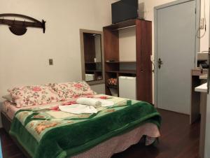 Postel nebo postele na pokoji v ubytování kitnet xixo 03