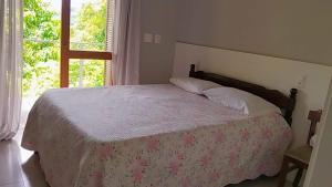 Postel nebo postele na pokoji v ubytování kitnet xixo 03 + 6 fotografií