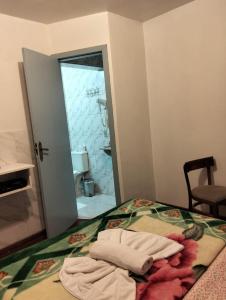 Postel nebo postele na pokoji v ubytování kitnet xixo 03