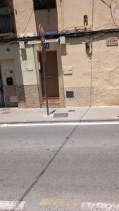 a stop sign on the side of a street at Casa con encanto con perritos in San Juan de Alicante