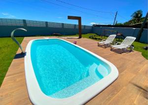 Bazén v ubytování Casa Vista do Sol, 5min de carro de Castelhanos, Frente Mar de Anchieta, 5 quartos-2 com ar condicionado lazer completo nebo v jeho okolí