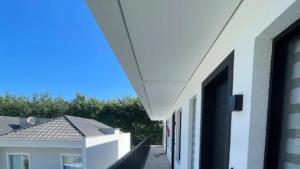 a view from the balcony of a white building at Compact Loft Residencial Flipchave CLO000 in Boa Vista
