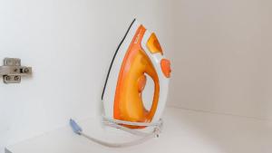 a vase with an orange object on a table at Compact Loft Residencial Flipchave CLO000 in Boa Vista