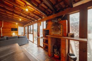 a living room with a couch and a fireplace at Porto Window Terrace House by Vacationy in Bandeira