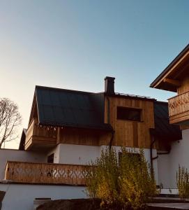 a house with a solar panel on the roof at Ferienhaus Korda in Ramsau am Dachstein