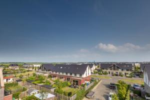 an aerial view of a residential neighbourhood with houses at Casa Mirador Sleep Inn in Almere +18 photos