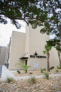 a building with a sign in front of it at Coastal Luxury Studio One Block to Big Rock in Morehead City
