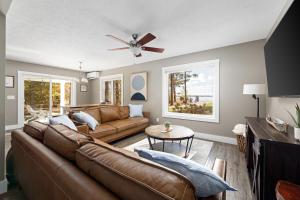 a living room with a couch and a table at The Long Lake Escape in Traverse City