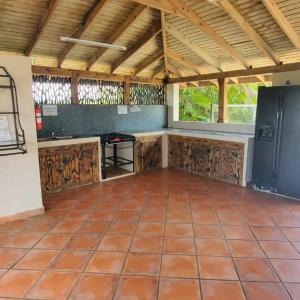 a large room with a tiled floor at Hacienda El Palmar D in Vega Baja