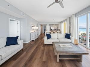 a living room with two couches and a table at Mermaid Manor in Navarre