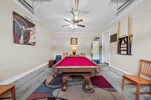 a pool table in a room with a ceiling at 3 Bedroom Home with King Bed, Fenced Yard & Pool Table in New Bern