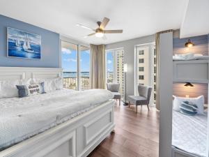 a bedroom with a bed with a view of the ocean at Mermaid Manor in Navarre