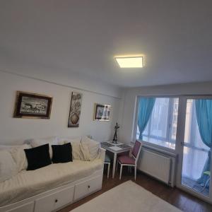 Giường trong phòng chung tại Apartament Flavia