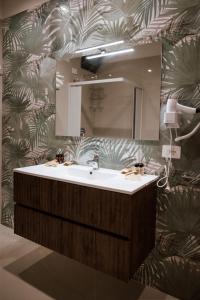 a bathroom with a sink and a mirror at Pantarei Palace in Lettere
