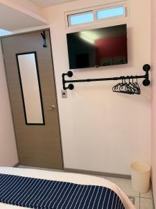 TV a/nebo společenská místnost v ubytování Habitación en Coyoacán 2