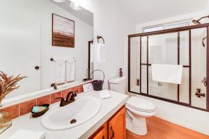 a white bathroom with a sink and a toilet at Mtn Gate Guest House about 6 Mi to Shasta Lake! in Shasta Lake +23 photos