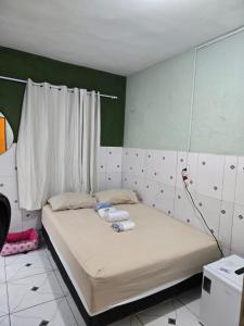 Postel nebo postele na pokoji v ubytování Residencial Lima QUARTO 02