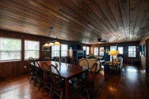 a dining room with a table and chairs at Commander in Edisto Island