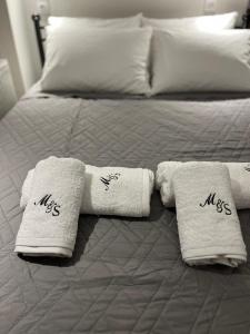 Ένα ή περισσότερα κρεβάτια σε δωμάτιο στο The M&S Residence